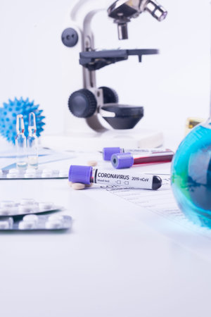 Blood test semple in lab. Coronavirus 2019-nCoV concept still life with blood test and drugs....