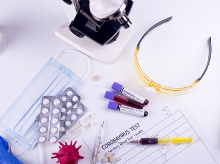 Blood test semple in lab. Coronavirus 2019-nCoV concept still life with blood test and drugs....