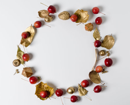 Autumn composition of golden leaves and ripe red wild apples. Fall theme, Halloween, or thanksgiving...