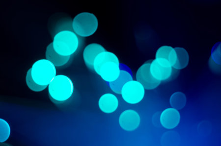Bright christmas eve background. Plenty of golden sparkling bokeh from defocused garland lights. Backdrop for designの写真素材