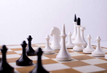 Checkmate Chess pieces on Chessboard. Chess opening tournament announcement background.の写真素材