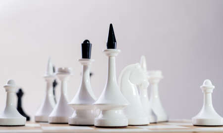 Checkmate Chess pieces on Chessboard. Chess opening tournament announcement background.の写真素材