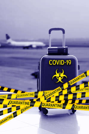 Flight canceled because of the pandemic coronavirus COVID-19 concept. Collage with caution yellow and black stripes biohazard sign over airport runway. Worldwide flight cancellation.の写真素材