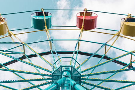 Ferris wheel under blue sky. Summer city parkの写真素材