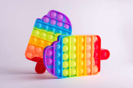 Picture of two antistress fidget toys in the form icecream isolated on white. Pop it popular game.の写真素材