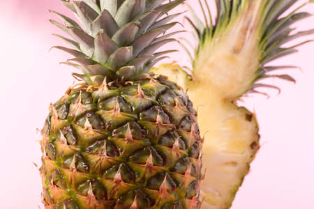 Fresh Ripe Pineapple against a pink background. Hello, Summer concept.の写真素材