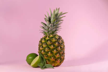 Fresh Ripe Pineapple against a pink background. Hello, Summer concept.の写真素材