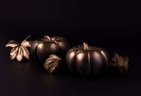 Gold and black luxury pumpkin. Minimalist banner good for thanksgiving and Halloween.の写真素材