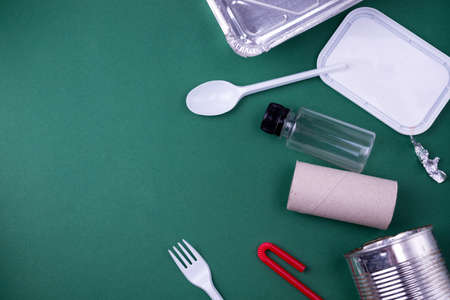 Reuse reduce recycle flat lay concept with plastic, paper, and polyethylene waste. Template image with copy space.の写真素材