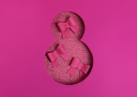 Number Eight Cutted in Paper on bright glitter pink Background decorated with bows. Happy Woman, 8...