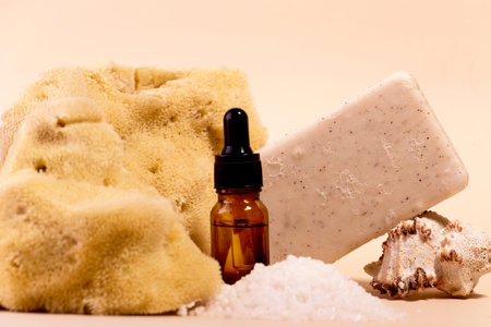 Spa And Beauty Care Set of Cosmetic oil Bottle Sea Sponge Soap and Various Shells.