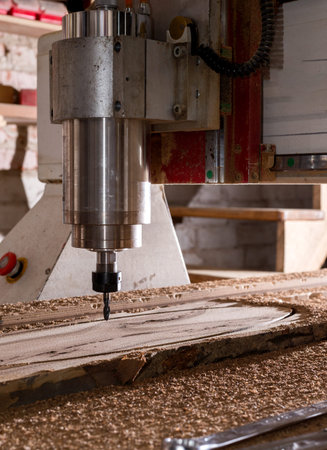 Woodwork cnc machine working on wood board. Tool at the wood factory.