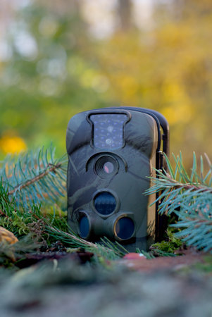 Trap or Trail Camera With Infrared Light and a motion detector on the Forest Floorの写真素材