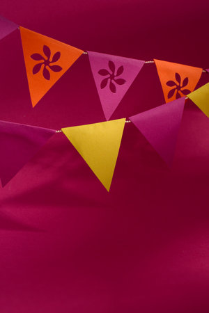 Colorful paper bunting against the Bright magenta background. Paper Garland in Mexico traditional festive colors.の写真素材