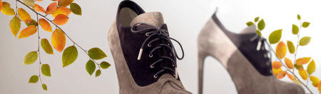 Womans Highheel boots against light backgroound. Creative Banner for Fashionable Retaile store adv...