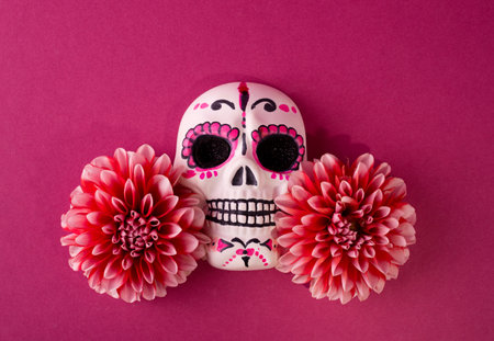Dia De Los Muertos or Day of the Dead Celebration Background. Skull Decorated with Pink Dahlia flowers against magenta background. Mexican Traditional Festiveの写真素材