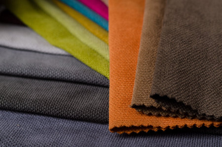 Brown, beige and grey colors velour textile samples. Fabric texture background