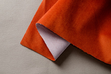Beige and coral colors soft velour fabrics textile samples.. Fabric texture background.の写真素材