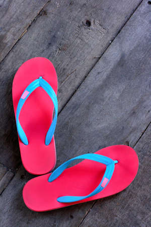 red slippers on wooden floorの写真素材