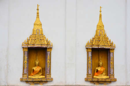 buddha statue on thai temple windowの写真素材