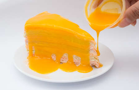 rainbow crepe cake with orange jamの写真素材