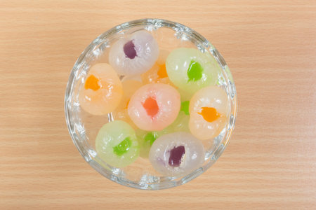 longan with jelly on wooden background