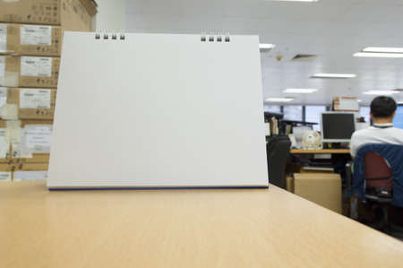 closeup blank calendar on wooden tableの写真素材