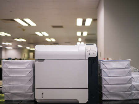 Laser printer and stack of paper in officeの写真素材