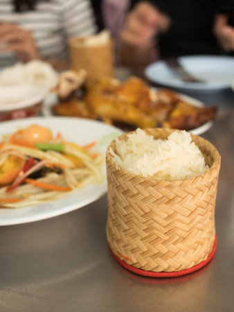 closeup sticky rice in bamboo container on table