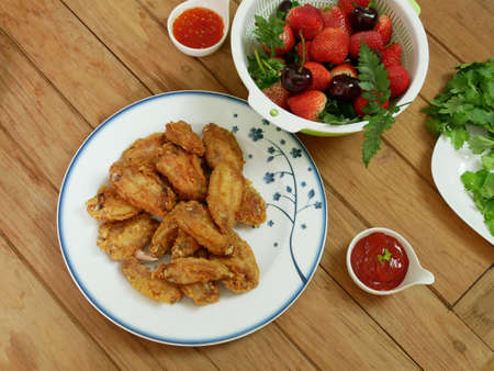 top view of fried chicken on wooden tableの写真素材