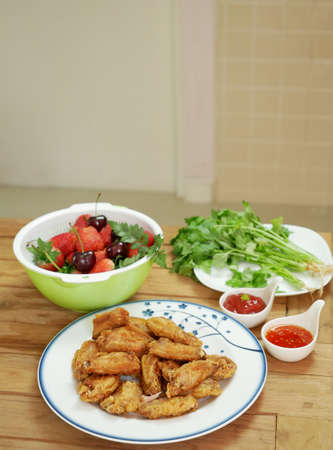 closeup fried chicken on wooden tableの写真素材
