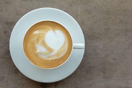 top view of hot coffee on wooden tableの写真素材