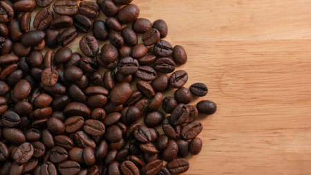 closeup roasted coffee beans on wooden backgroundの写真素材