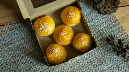 top view of bean cake with salted egg yolk in paper boxの写真素材