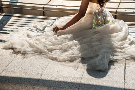 Closeup of white lace wedding dress. Vintage tulle chiffon texture background. Wedding concept.の写真素材