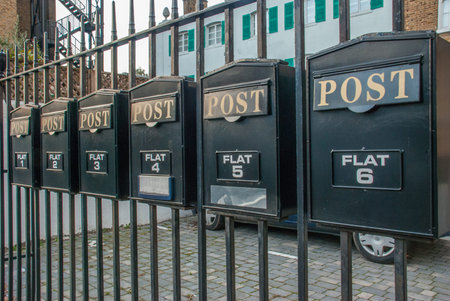 Mailbox on a steel fence In front of flats in London