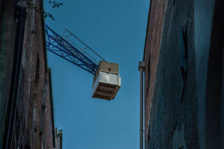 Construction site with cranes on sky backgroundの写真素材