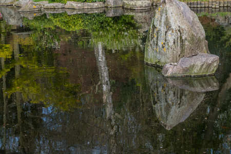 Japanese garden decorated with flowers and stones Beautiful and calmの写真素材