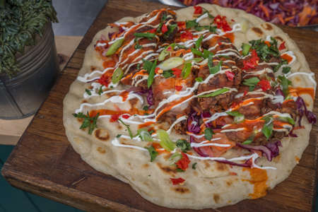 Traditional pizza Delicious on wooden background in the borough market.の写真素材