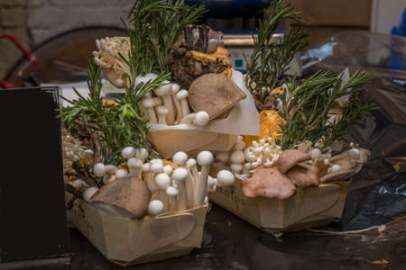 White beech mushrooms or Shimeji mushrooms in Carton box on wooden background.の写真素材