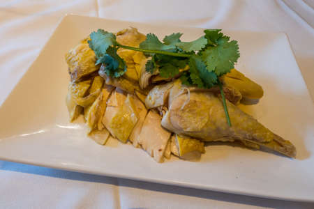 Chinese drunken chicken - marinated steamed chicken in Chinese liquor or whiskey overnight in the refrigerator. Serving chilled as an appetizer.の写真素材