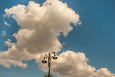 Vintage street lamp With blue sky and white cloud. Suitable for making background images.の写真素材