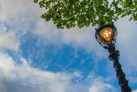 Ancient street lamps with trees that haveBackground is the sky Suitable for background images.の写真素材