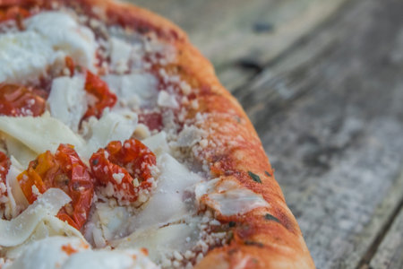 Pizza margherita on the wooden table.