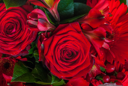 beautiful bouquet of red rose flower, the work of the florist at a flower shop, background on full...
