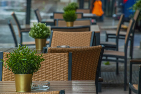 Empty cafe at the Street On a rainy day with comfy chairs and clean tables in London.の写真素材