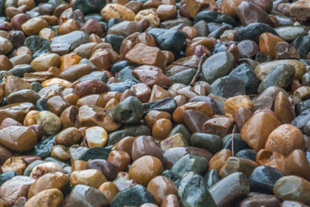 Abstract background texture, Colorful sea stones, Oblique view from the top.の写真素材