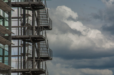 Business building with metal emergency ladder / fire escape in modern office buildings with...