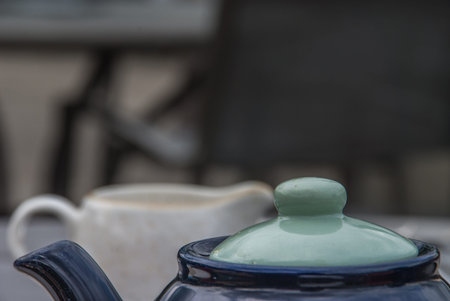 Their upper part of Cup of tea with teapot, space for textの写真素材