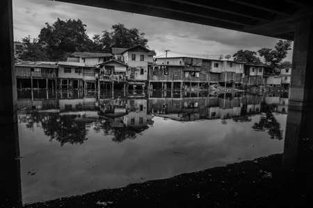 Traditional old house on Khlong Phra Khanong and near the expressway, Black and white.の写真素材